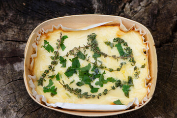 lasagna, pasta with beef and cheese in a package on a wooden background