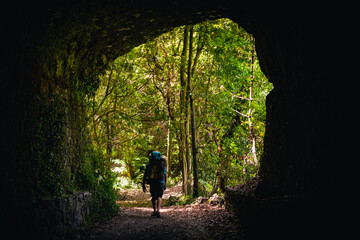 Hiker on the forest path in the tunel