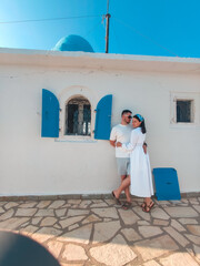 couple travelers near old greece church