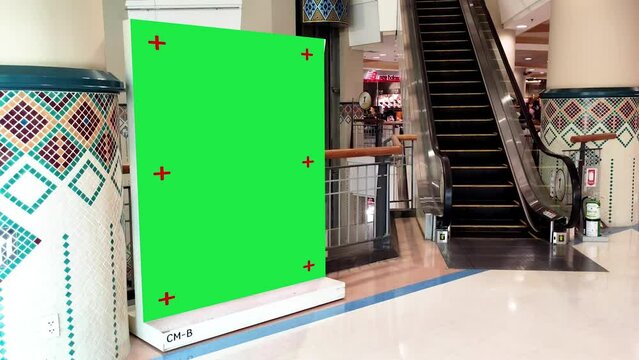 Green screen Advertising billboard for product display with modern escalator stairs background , Chroma key, Alpha channel.