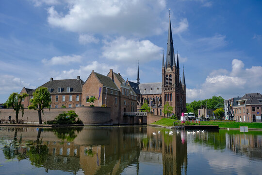 Woerden, Netherlands - Castle of Woerden (built in ca. 1407) with behind it the catholic Sint-Bonaventura church (built in ca. 1892)