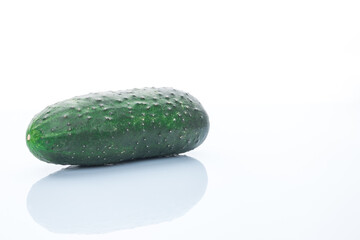 Green cucumber on white background