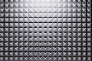background texture metallic cubes-pyramids, illuminated by a beam of light. soundproofing sheets. 3d image. 3d render.