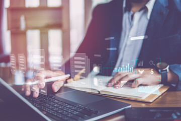 Business technology concept, business analysis and strategy, big data,Business man analyzing financial graph on virtual touch screen and futuristic technology solution for business development.