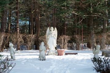 Sculptures of Angel and praying Fatima children in Our lady of Fatima shrine Holliston MA USA - obrazy, fototapety, plakaty