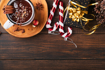 Hot chocolate. Homemade spicy hot chocolate with cinnamon, crushed hazelnut, christmas decor and...