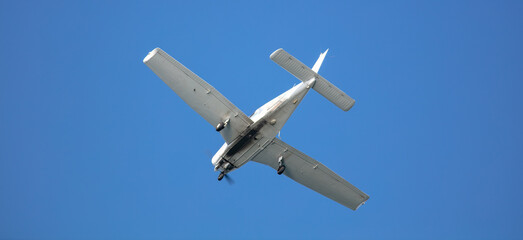 A General Aviation Airplane from below looking at the Wings and the Fuselage