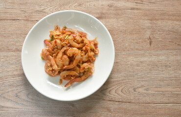 spicy and sour boiled shrimp with slice lemon grassThai salad on plate