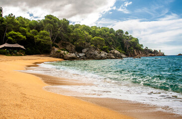 Sea surf on the beach of Santa Cristina in Lloret de Mar
