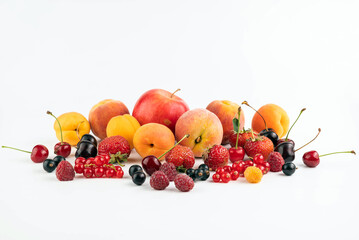 On a white background different ripe fruits and berries.