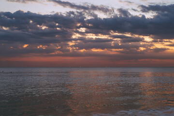 Sunset on the ocean, bright colors. Bali, Indonesia.