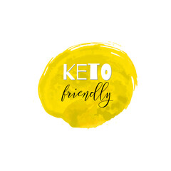 Keto friendly. Lettering on hand paint yellow watercolor texture isolated on white background. Ink dry brush stains, stroke, splash, smudge, scribble. Low carb high fat motivation quote menu poster. - 515885229