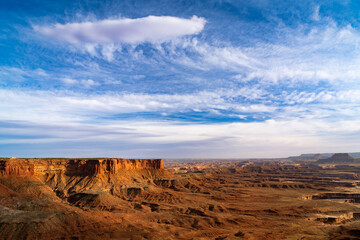 Vast barren, desert landscape of canyons and mesas under a dramatic sky 
in Canyonlands National Park, Utah