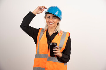Construction worker with cup of tea feeling happy