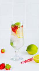 Refreshing cocktail with lime and strawberries