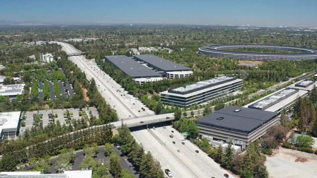 Aerial orbit shot of highway traffic in San Jose, California near Silicon Valley