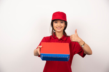 Young smiling woman in red uniform delivering pizza in box