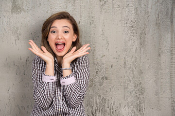 Photo of a young pretty woman sitting and posing