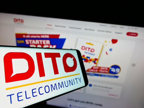 Stuttgart, Germany - 01-22-2022: Smartphone with logo of Philippine company Dito Telecommunity Corporation on screen in front of business website. Focus on center of phone display.