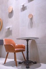 Side view of empty table set beside gray tile wall decoration in minimal style and vertical frame