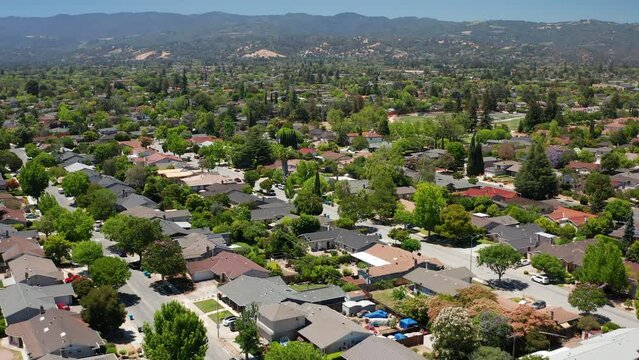 Aerial shot of suburban homes in northern California with beautiful trees 