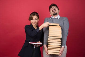 Woman employee taking book from her colleague