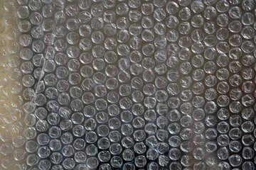 Air bubble wrap close-up. Bubble wrap texture. Texture background packaging material. The film...