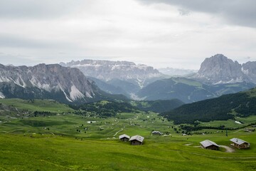 Fototapeta na wymiar Green grass hills in the Dolomites