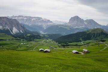 Fototapeta na wymiar Green grass hills in Seceda at the Dolomites