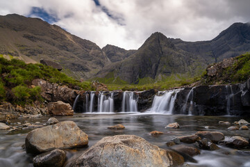 Fototapeta na wymiar the idyllic and picturesque cascades and pools at the Fairy Pools of the River Brittle on the Isle of Skye