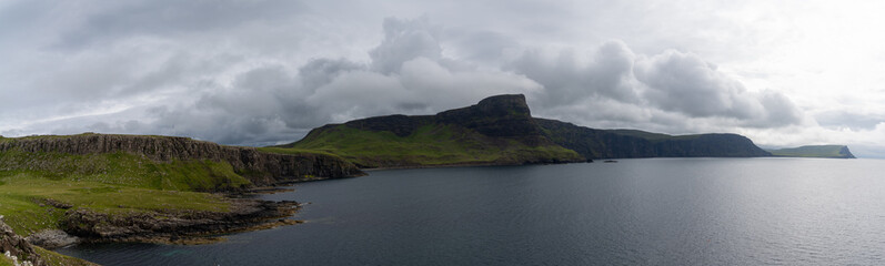 Obraz premium panorama landscape of the green cliffs on the coast of Neist Point on the Isle of Skye
