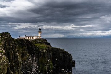 Fototapeta na wymiar the Neist Point Lighthouse on the green cliffs of the Isle of Skye