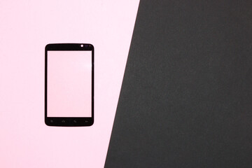 mobile phone with pink screen as copy space, on pink-black background with more copy space, modern design, creative minimal concept, abstract technology background