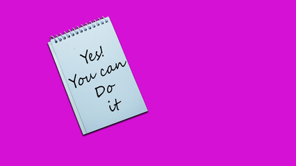 yes you can do it Hand writing on a notebook. lifestyle, advice, motivational positive words are written on a solid background. Business, signs, symbols, concepts. Copy space.