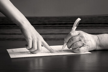 An old woman is forced to write a will for an apartment