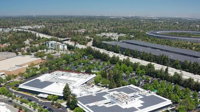 Aerial pullback shot of Cupertino San Jose with highway traffic in background