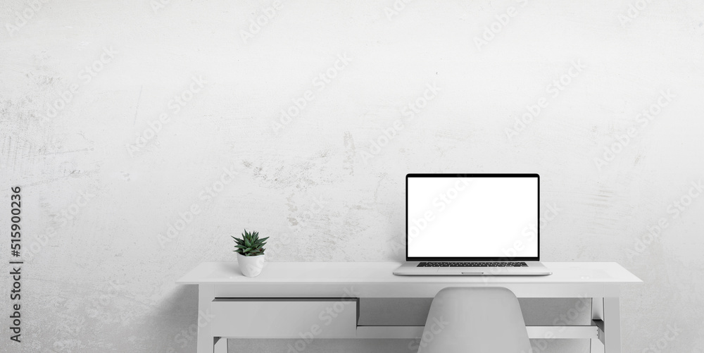 Leinwandbilder Laptop computer on work desk with isolated in white display screen for web page promotion. Clean space beside for copy