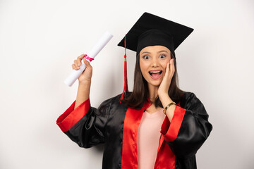 College graduate female in gown feeling happy on white background