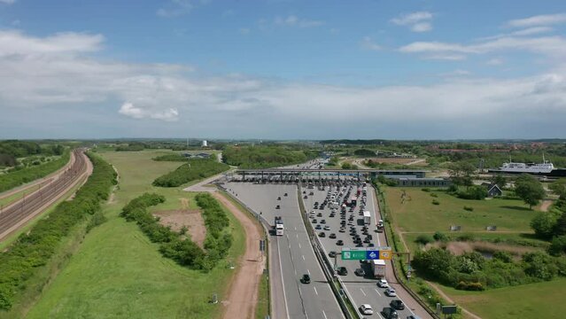 Aerial view on the traffic at the toll collection point (toll booth) on the highway near the Great Belt bridge (&Oslash;stbroen) in Denmark