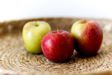 red and green apples on a table in natural design