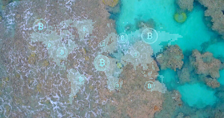 Image of world map and bitcoins over seashore with waves