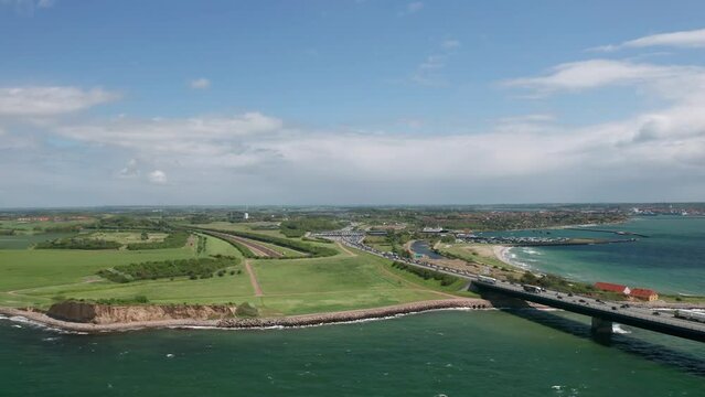 Aerial view on the Zealand shore: toll booth at the famous Great Belt suspension bridge (&Oslash;stbroen) and railway entrance to the underwater tunnel for trains. Denmark