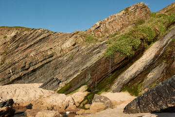 Small waterfall on the Amalia Beach (Praia da Amalia).  Western part of Algarve, Portugal