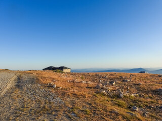 Mountain landscape at Torre, Serra da Estrela, Portugal. View of the mountain chain and golden grass.