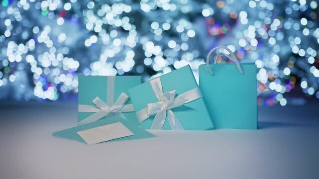 Magical forest fairy lights background. Beautiful elegant light blue gift boxes on white snowbank with shiny christmas wonderland forest on blurry background. Holidays sale copy space footage 6K