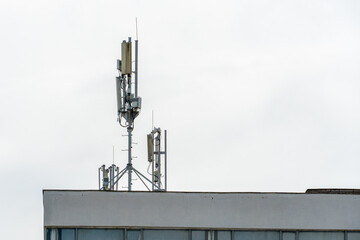 New GSM antennas on the roof of a building for transmitting a 5g signal are dangerous to health. Radiation pollution of the environment through cell towers. The threat of extinction of the population