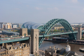 Newcastle upon Tyne UK: 15th April 2022 a panoramic shot of the famous Newcastle Quayside and Tyne Bridge from a high viewpoint (at Above in the Vermont Hotel) on a hazy day