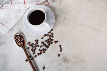Cup of coffee and coffee beans background. Food and beverage concept.