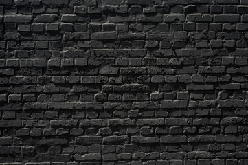Old black brick wall texture ,brick wall texture for interior design vintage dark tone.