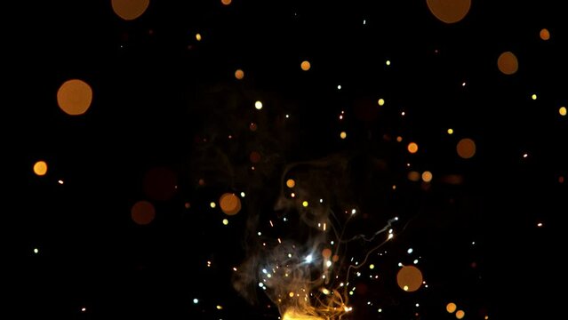 Super Slow Motion of Flying Fire Sparkles. Detail shot, Low Depth of Focus. Filmed on High Speed Cinema Camera, 1000 fps.